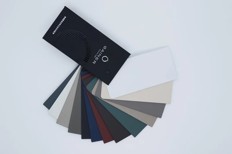 Gainer aluminium finish colour fan photographed on a pale background
