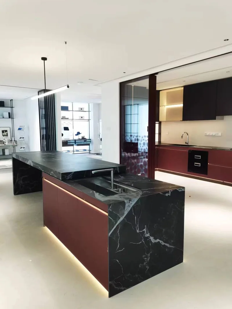 Kitchen cabinets and a stone-surface island in a past Gainer interior project