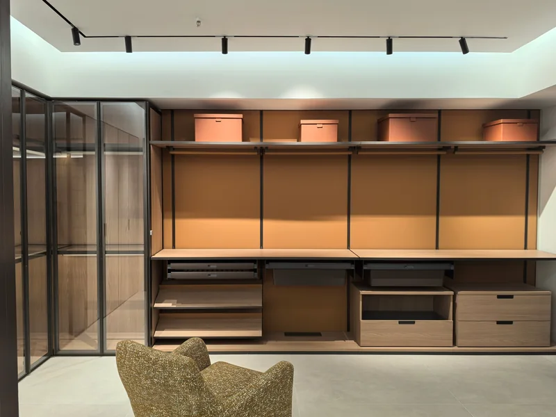 Glass cabinet doors, timber shelves and hanging rails in a past Gainer wardrobe project